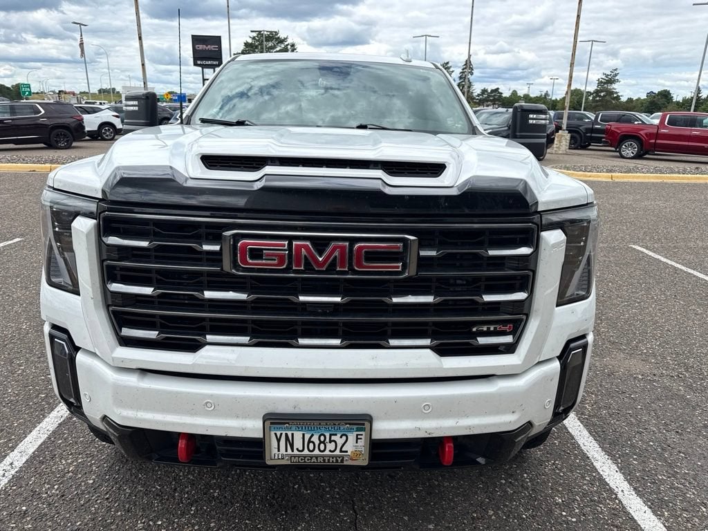 Used 2024 GMC Sierra 3500HD AT4 with VIN 1GT49VEYXRF207668 for sale in Minneapolis, Minnesota